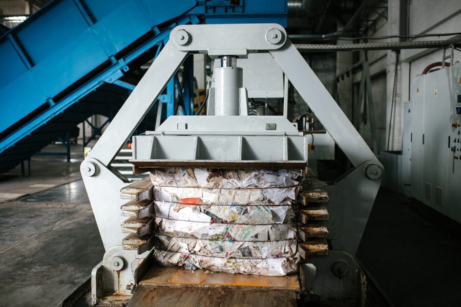 Special equipment for pressing paper waste at a waste sorting plant for further disposal or recycling.